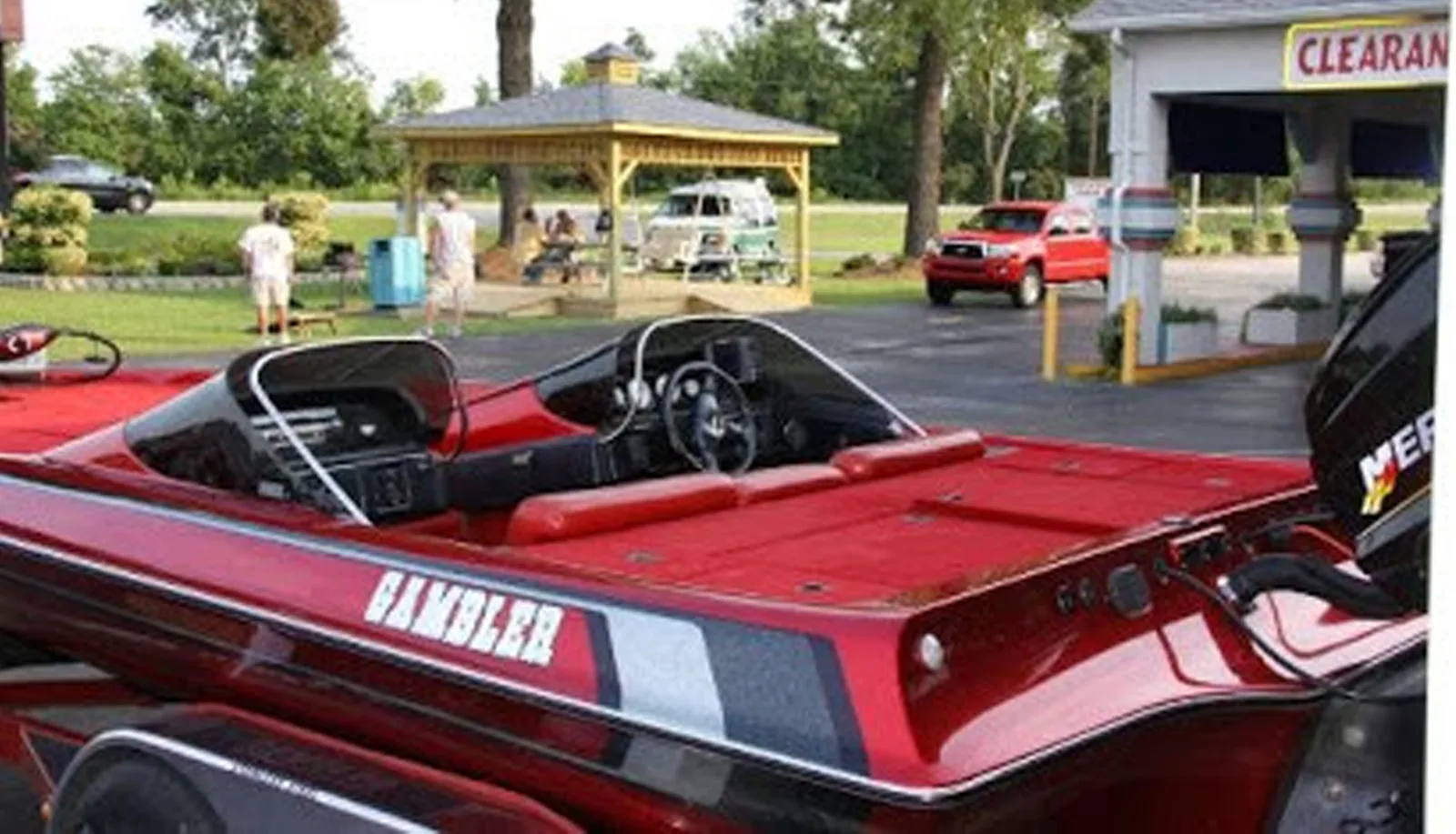 Red speedboat with black interior displayed at Sportsman Inn