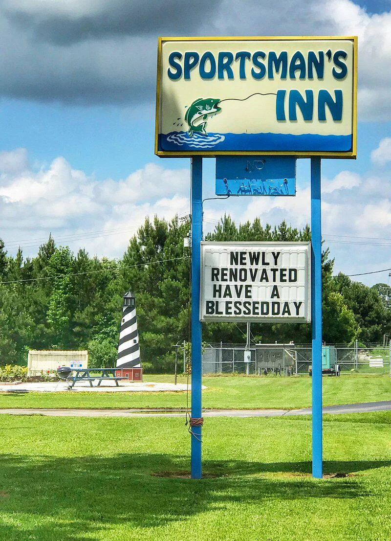 Sportsman's Inn roadside sign with fishing graphic and "Newly Renovated" message in Plymouth, NC